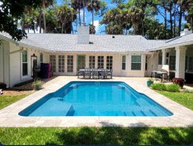 The same backyard with a photorealistic pool in it